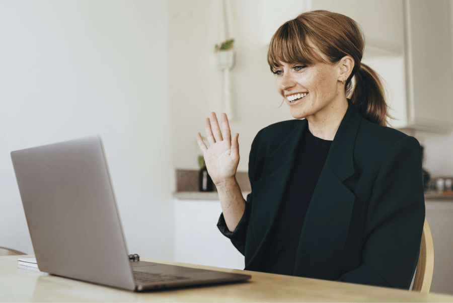 Woman in video call in front of desktop